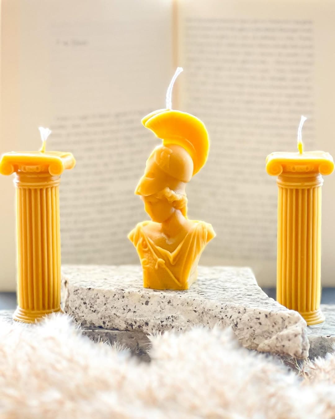 Minerva, a Roman goddess bust beeswax candle flanked by two column candles