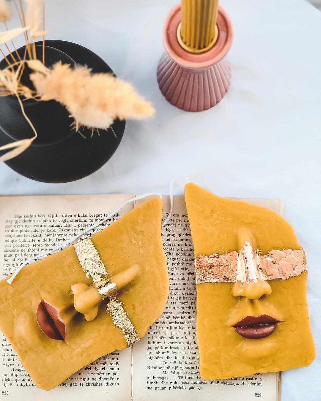 Muse, sculpted face plaque candles with hand-applied gold leaf