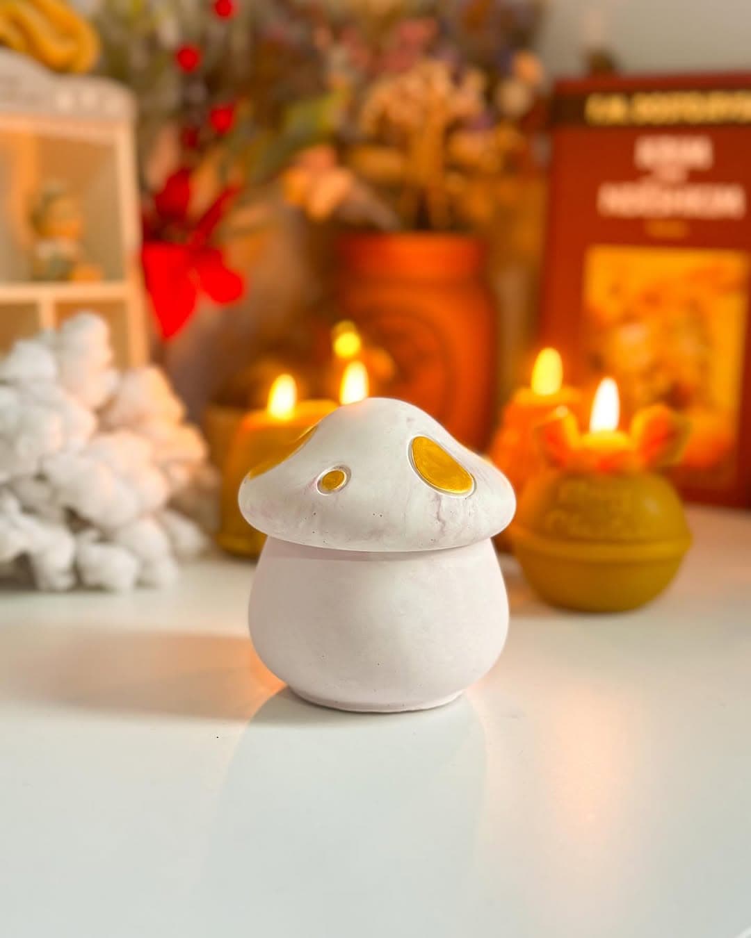 Mushroom-shaped beeswax candle in a glass, practical and pretty