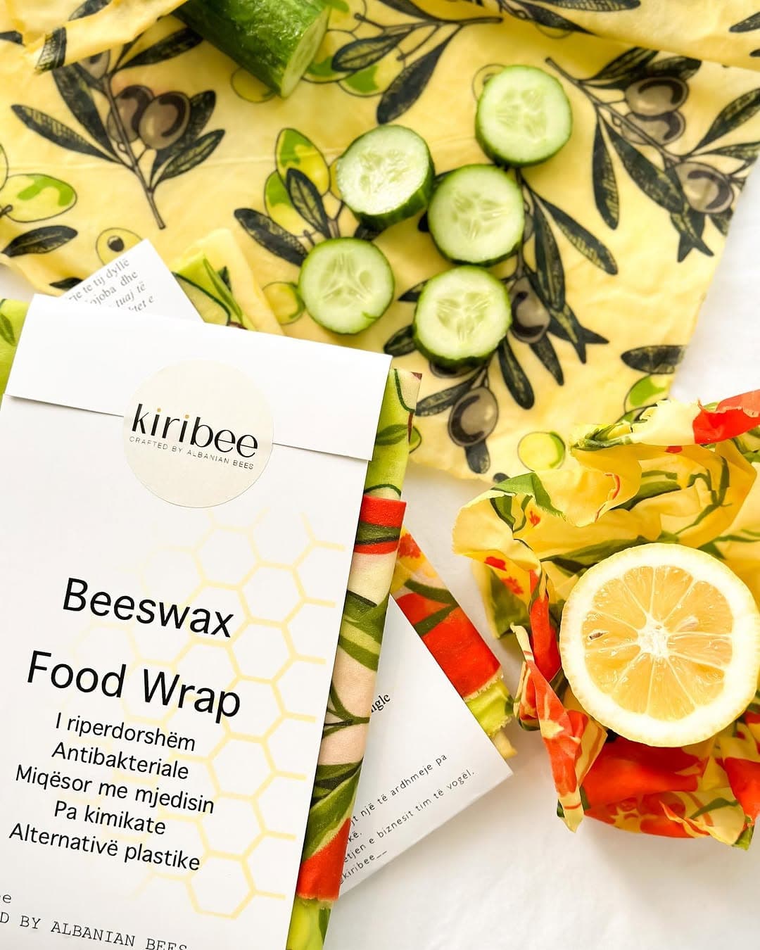 Kiribee beeswax food wraps, patterned cotton cloth wrapped around lemon and cucumber slices